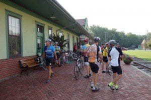 BikeMO Riders rest at the historic Katy Depot in Boonville